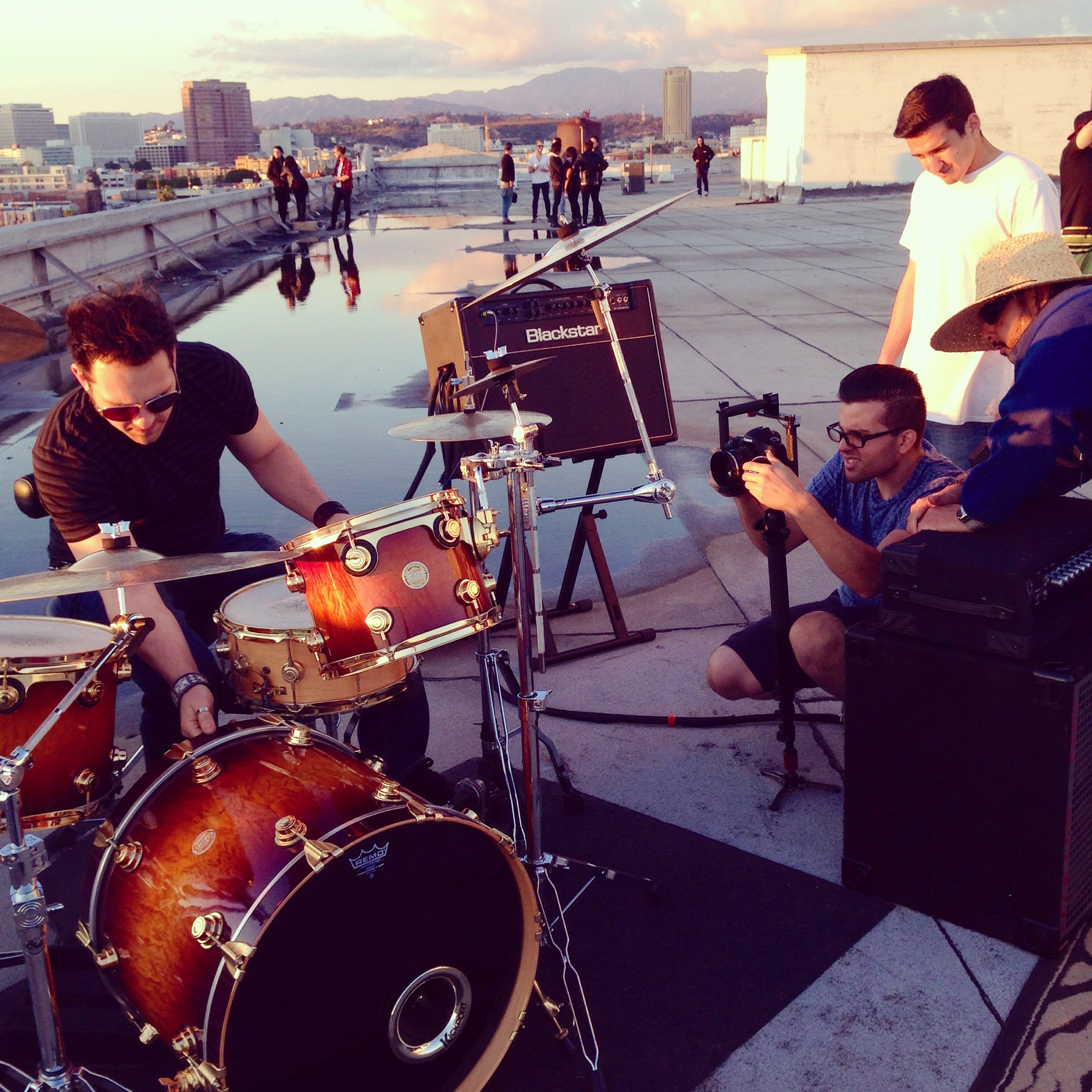 Drummer performing on LA rooftop — music video shoot